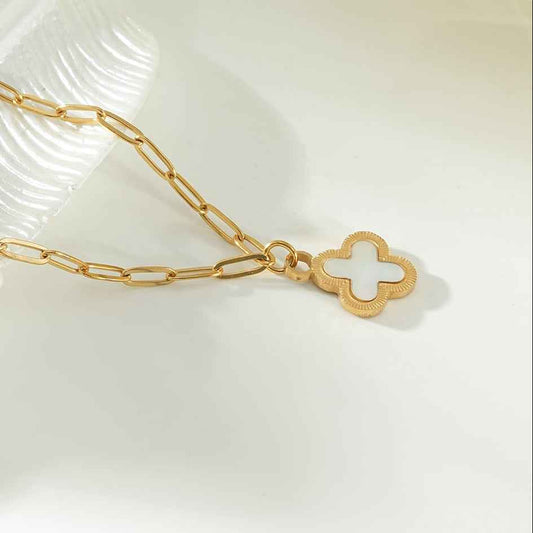 MAKA Gold: Clover Shaped Charm in Natural Shell & Gold Metal Border on a Paperclip Chain