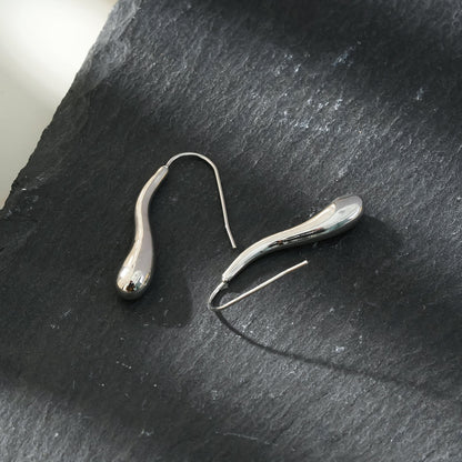 Style CORNING Silver (White Gold): Tadpole-Shaped Earrings – Unique Elegance with a Playful Twist
