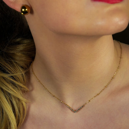 SANITA: Beaded Dainty Chain Anchoring 'V' Shaped Zirconia Embedded Pendant Charm